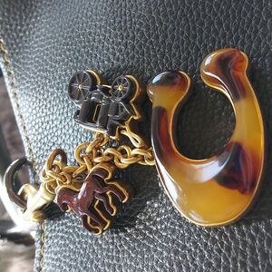Coach 🐎 Retail brass and resin retired bag charm